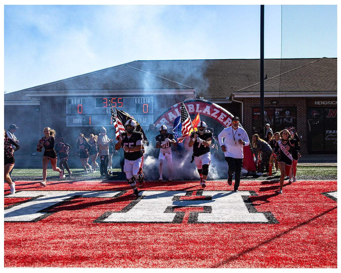 Team running out of the tunnel onto the field